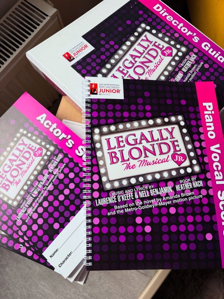 Scripts and a piano vocal score for Legally Blonde The Musical Jr.